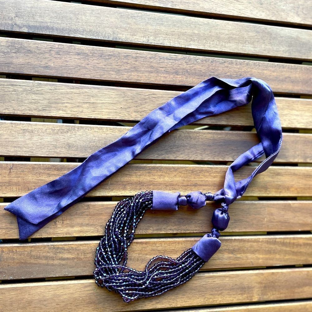 Purple plastic beaded necklace